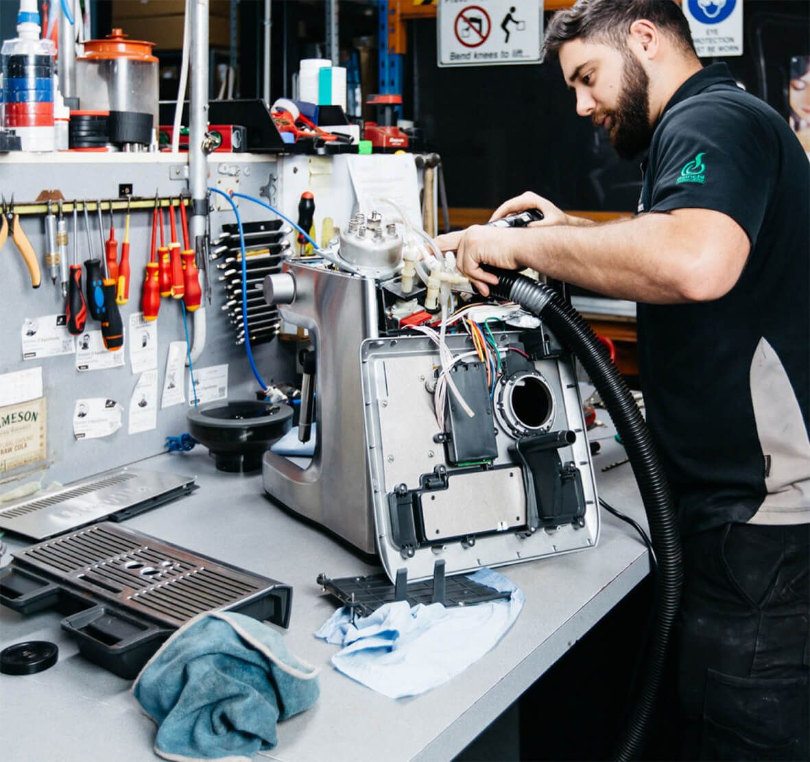Appliance repair technician at work